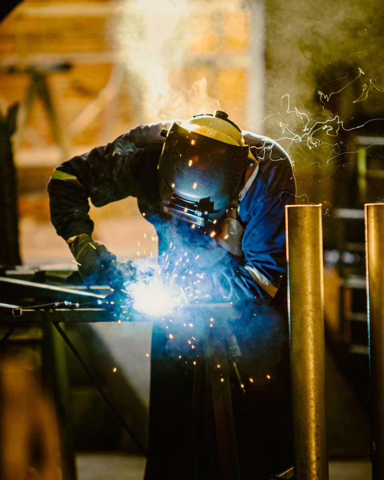Welder at work in protective gear